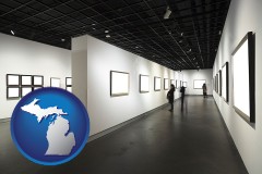michigan map icon and people viewing paintings in an art museum